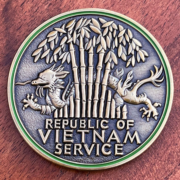 Round 3D challenge coin honoring veterans of the Vietnam War. 