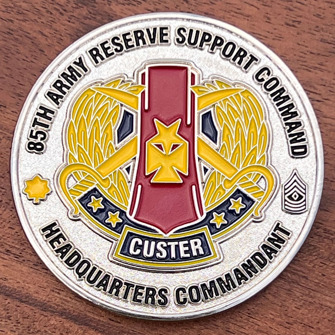 Polished silver round challenge coin belonging to 85th Army Reserve Support Command