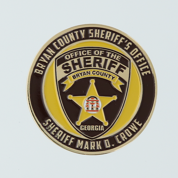 Black and gold coin featuring Bryan County GA Sheriff's offic shield at center