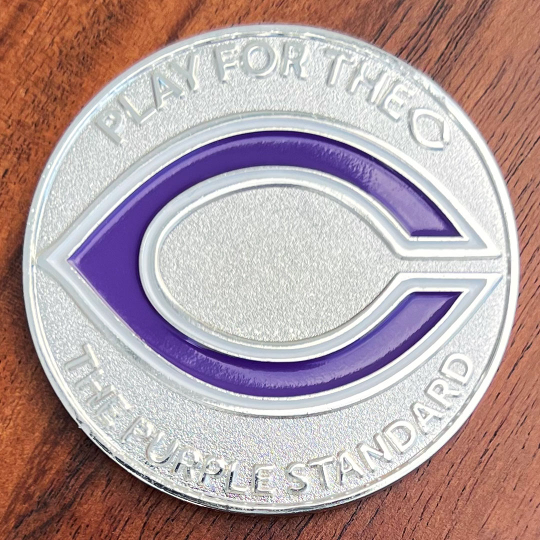 Round polished silver challenge coin created for Canyon Texas. Purple letter "C" at center. High School Canyon Eagles football team