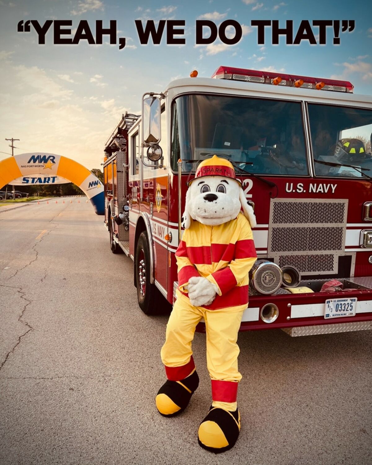 photo showing U.S. Navy fire truck and firefighter dressed in dog costume, phrase "Yeah, we do THAT"