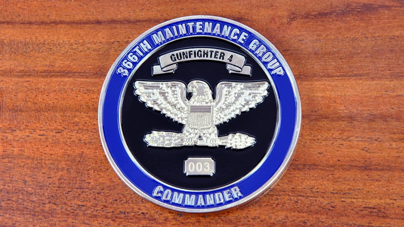 Round challenge coin representing 366th Maintenance Group Commander