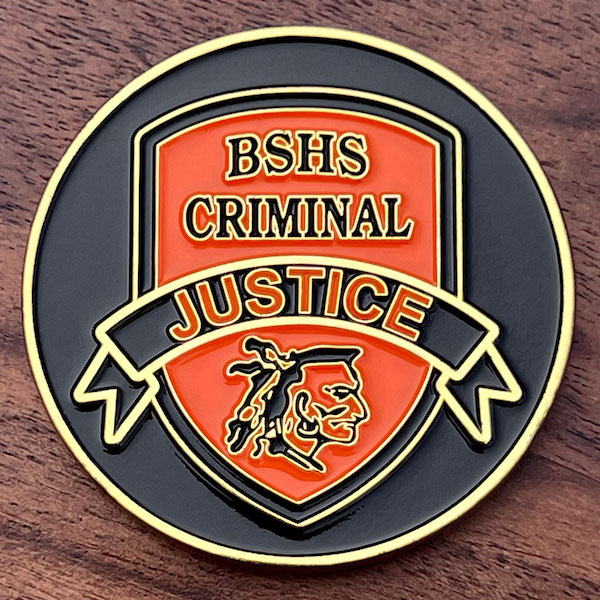 Round gold challenge coin for Berkeley Springs High School's Criminal Justice Program. 