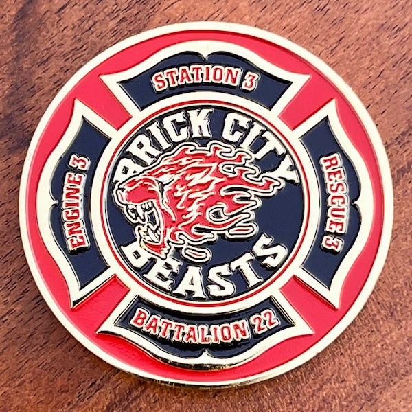 Round coin with St. Florian Cross representing "Brick City Beasts" firefighters