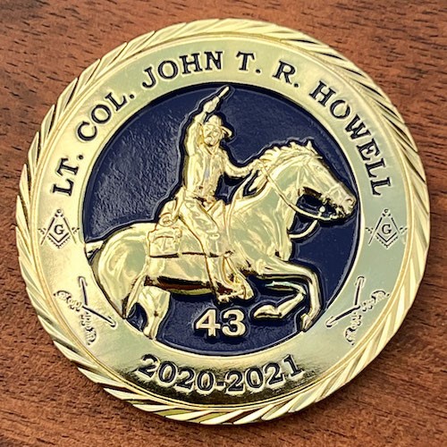 Gold 3D challenge coin for Lt. Col. John T. R. Howell. 