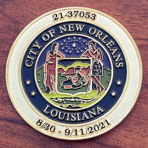 Round polished gold challenge coin belonging to the city of of New Orleans, Louisiana. 