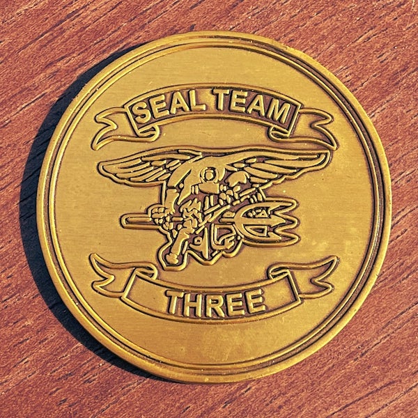 Round Seal Team Three military challenge coin. 