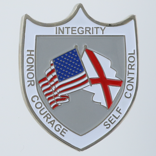 Reverse side of a shield-shaped challenge coin belonging to the Law Enforcement Academy-Tuscaloosa in Tuscaloosa, Alabama. 