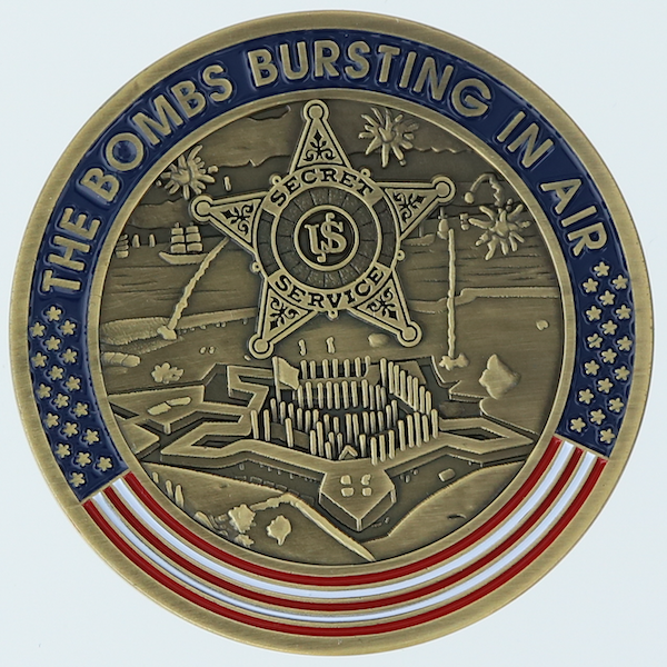Reverse side of a round challenge coin belonging to the United States Sercret Service's Baltimore Field Office. 
