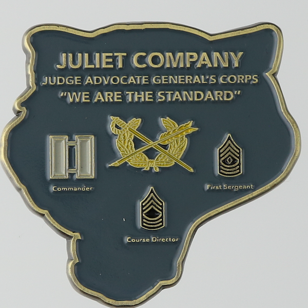 Reverse side of a custom jaguar-head shaped challenge coin for the Juliet Company of the JAG Corps. 