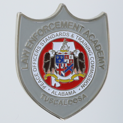 Front side of a shield-shaped challenge coin belonging to the Law Enforcement Academy-Tuscaloosa in Tuscaloosa, Alabama. 