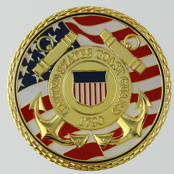 Reverse side of a round polished gold challenge coin belonging to the United States Coast Guard Aviation Technical Training Center in Elizabeth City, North Carolina. 