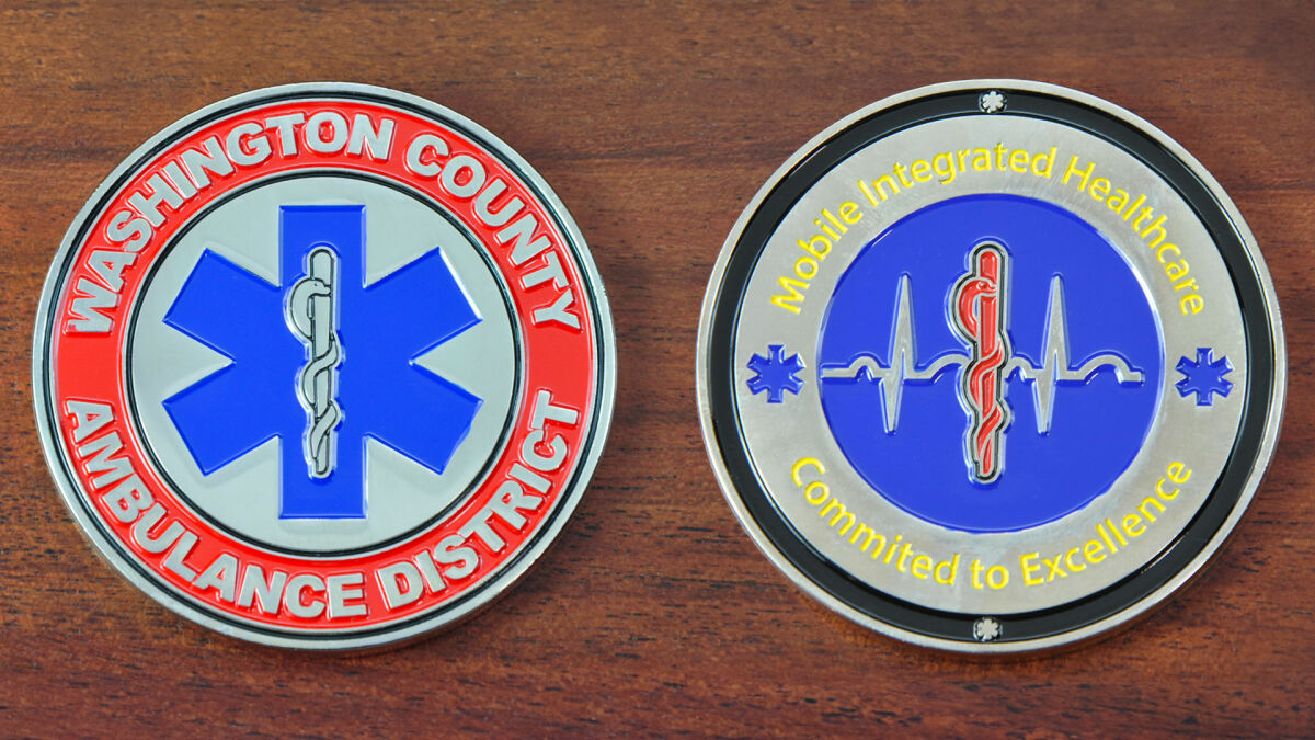 Round challenge coin representing the Washington County Ambulance District