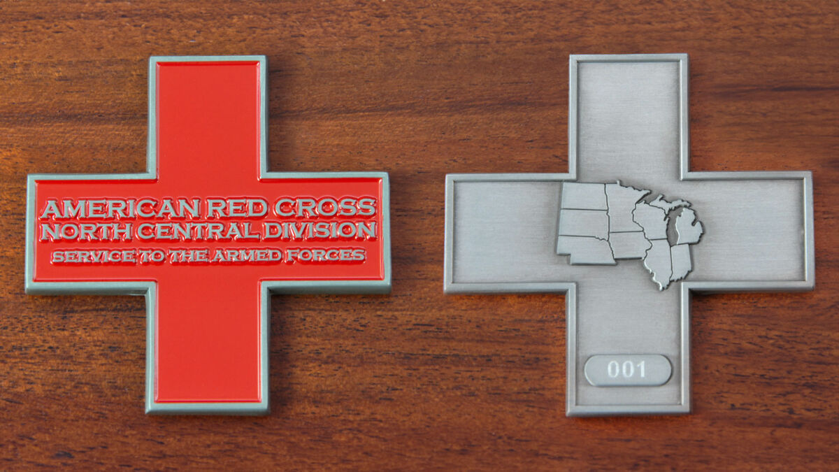 Cross-shaped challenge coin representing the American Red Cross North Central Division