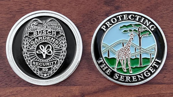 Front and reverse side of a polished silver challenge coin for Busch Gardens Tampa Bay. 