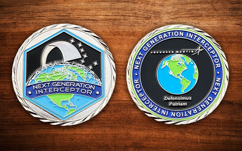Front and reverse side of a polished silver challenge coin for Lockheed Martin's Next Generation Interceptor program. 