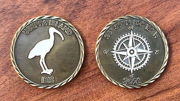 Round challenge coin for Useppa Island, Florida, front and back
